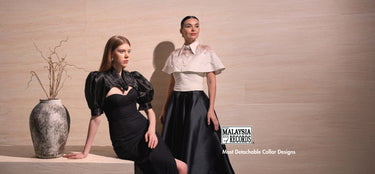 Two women in black collar and white collar posing together