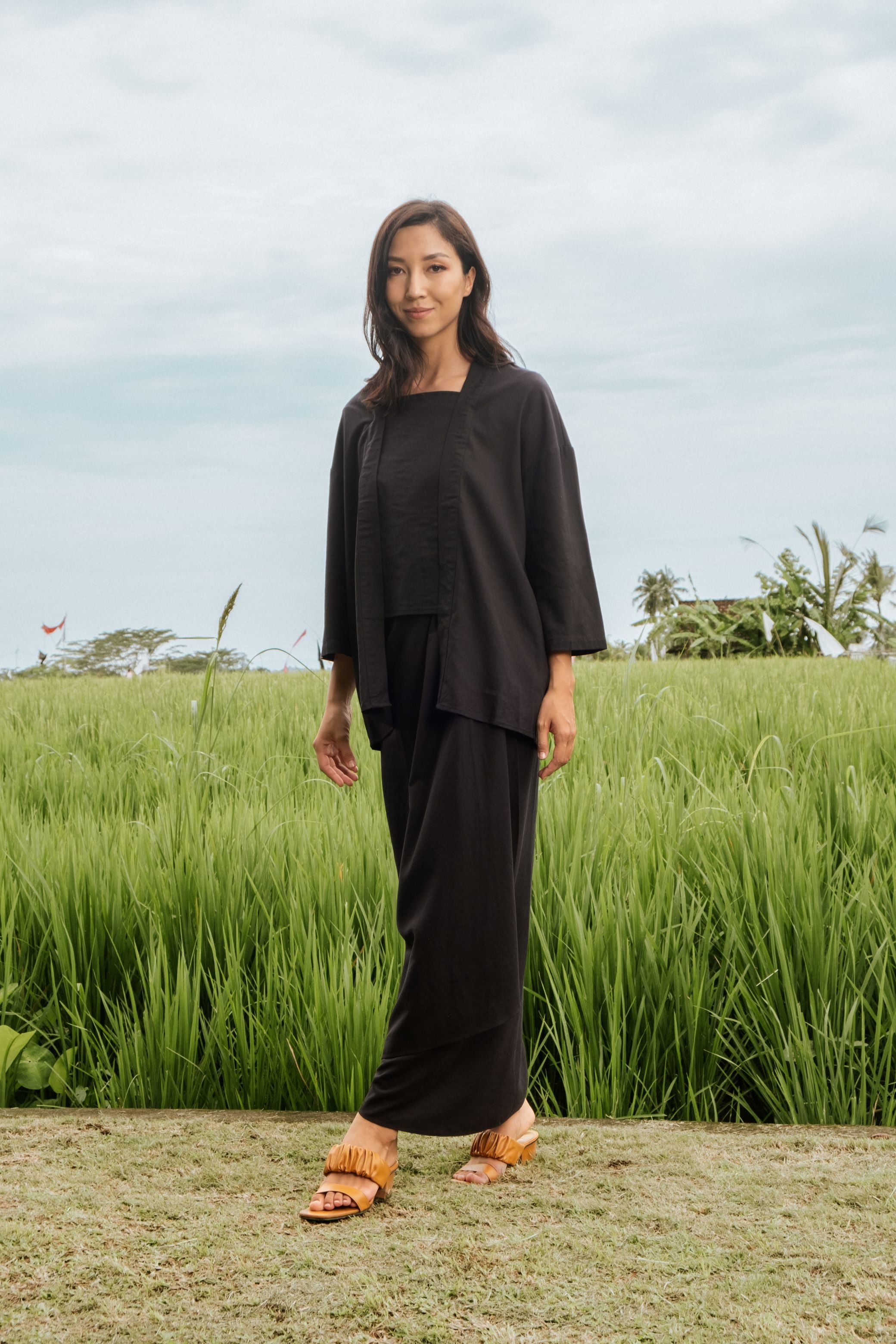 woman posing for camera wearing 2-in-1 kebaya top black