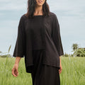 close shot of woman in black 2-in-1 kebaya top