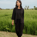 woman looking right standing pose in 2-in-1 kebaya top black