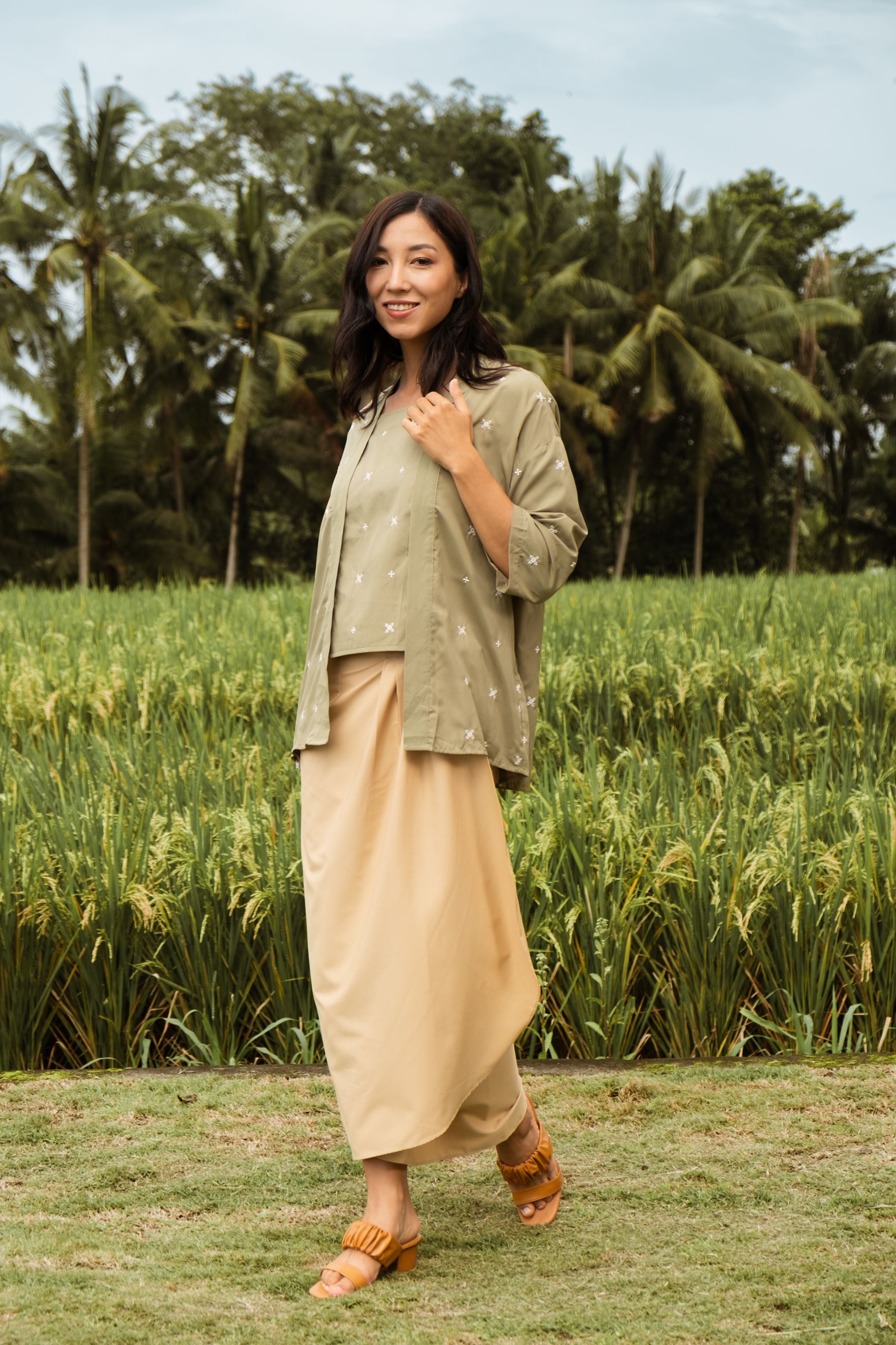 happy woman wearing instant wrap skirt khaki and posing