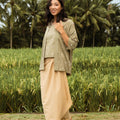 happy woman wearing instant wrap skirt khaki and posing