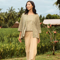 pretty woman standing pose in instant wrap skirt khaki