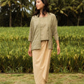 woman looking right, posing in instant wrap skirt khaki