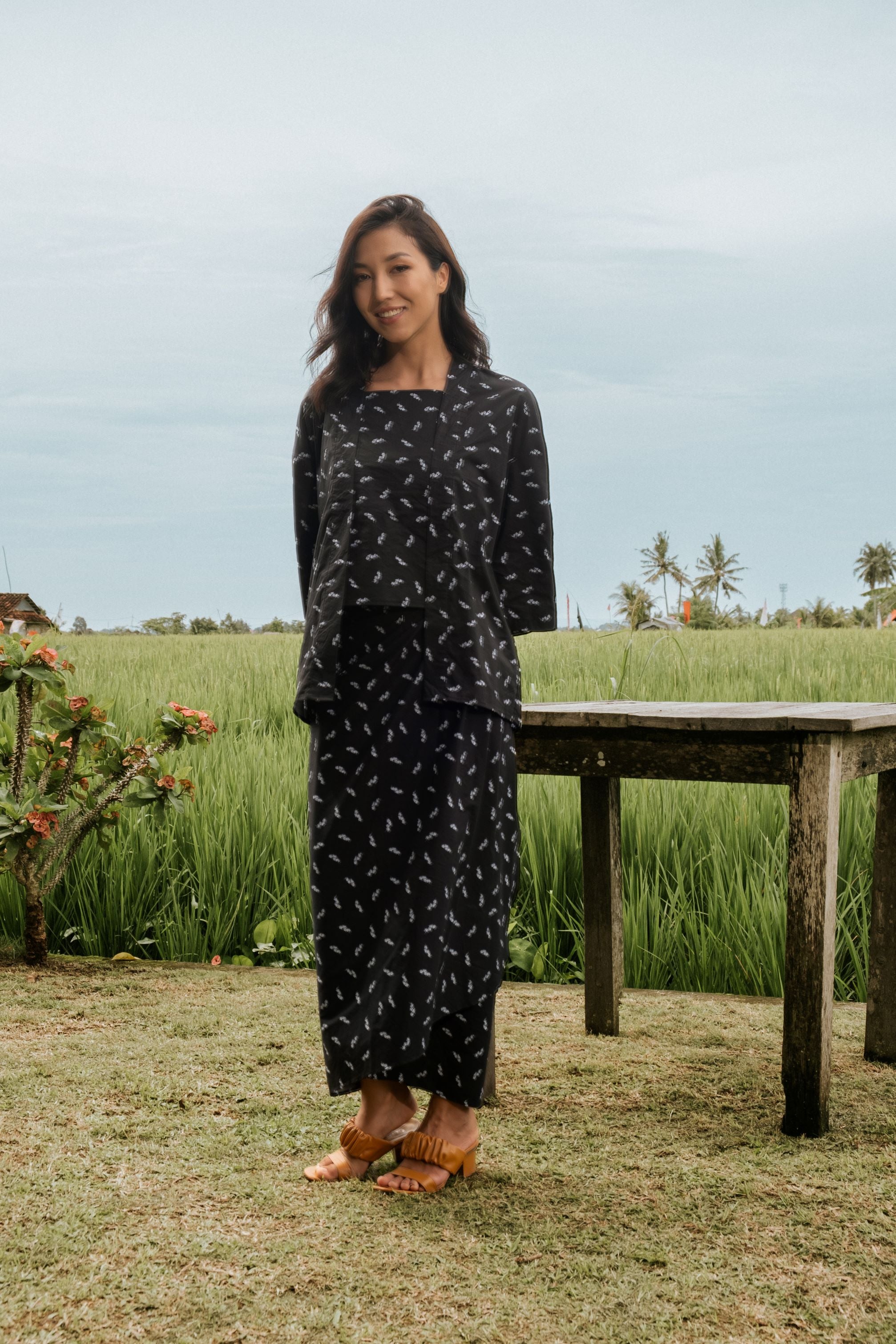 standing pose of woman wearing melati print instant wrap skirt