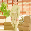 5-6 years old boy posing in weave pattern green sampin