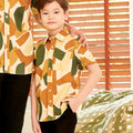 close shot of young boy wearing nasi lemak print (retro effect) short-sleeve button collar shirt