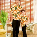 young boy and man standing with one hand in pocket wearing nasi lemak print (retro effect) short-sleeve button collar shirt