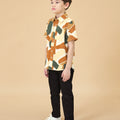 side view of young boy standing with nasi lemak print (retro effect) short-sleeve button collar shirt