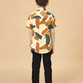 5-6 years old boy posing backwards in nasi lemak print (retro effect) short-sleeve collar shirt with buttons 