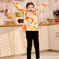 happy young boy posing in marmalade print top teluk belanga