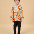 lookbook portrait of boy wearing teluk belanga marmalade print top