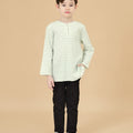 5-6 years old boy standing wearing teluk belanga pandan print top