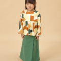 little girl standing pose in pine green classic skirt