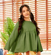 close shot of young girl wearing pine green ruffles top