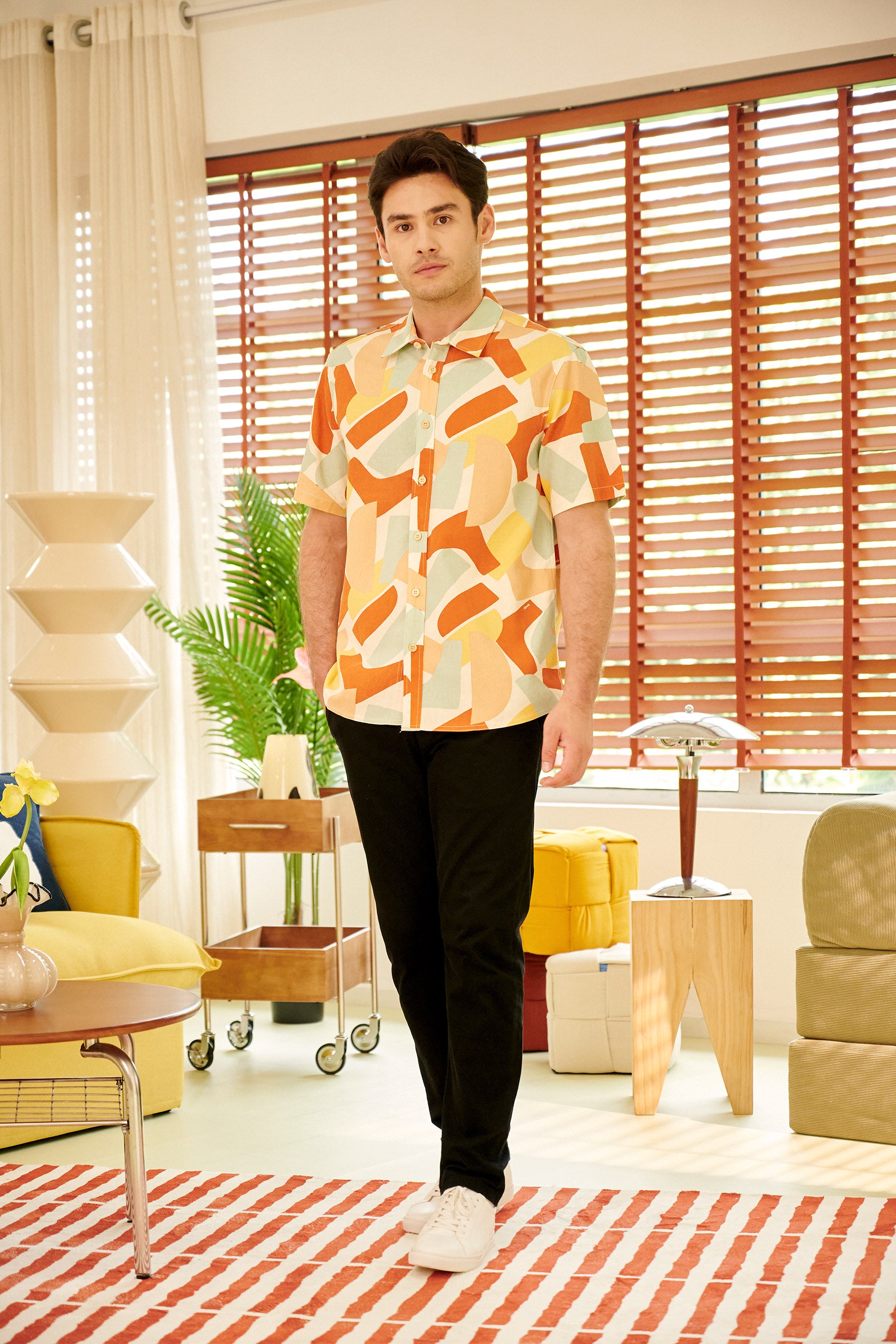 man wearing holiday shirt marmalade print looking at camera