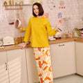 woman in marmalade print classic skirt with scallop embroidery looking at camera and smiling