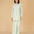 woman standing posing in mandarin collar kurung top pandan print