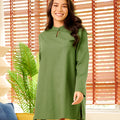 happy woman smiling wearing pine green mandarin collar kurung top