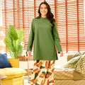 woman in pine green mandarin collar kurung top smiling at camera