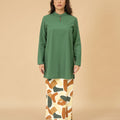 standing pose of woman in pine green mandarin collar kurung top