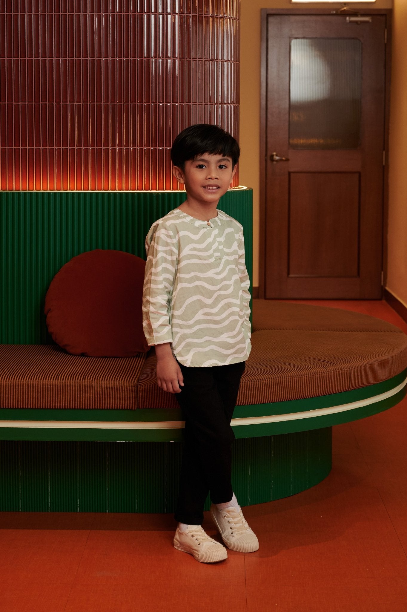 The Early Check - in Collection Boy Teluk Belanga in Meadow Print - Umbi