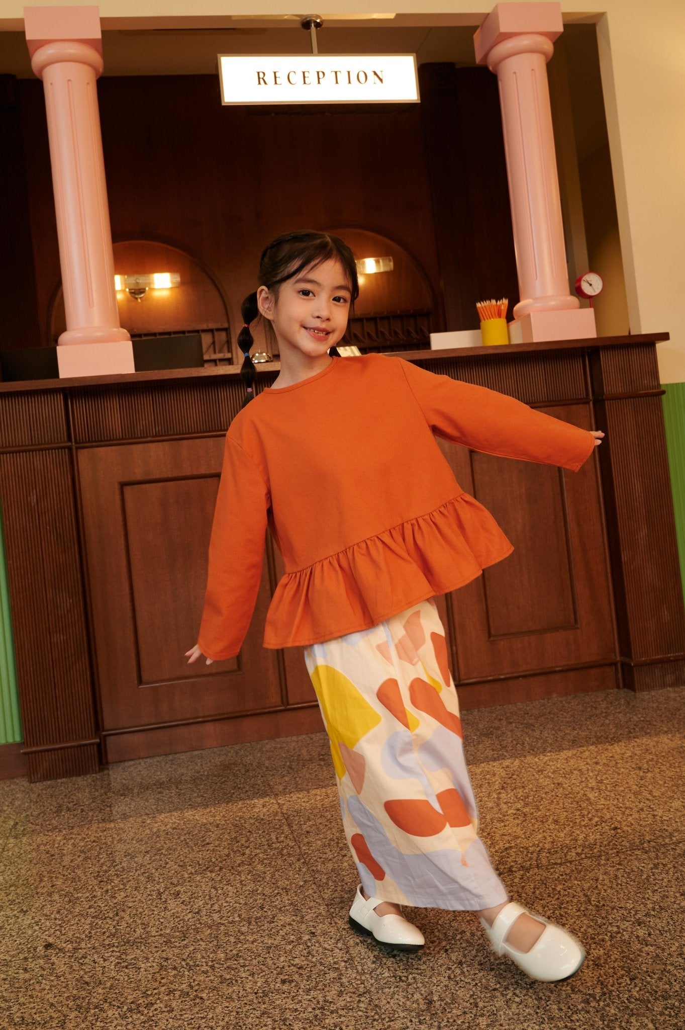 The Early Check - in Collection Girl Ruffles Top in Orange - Umbi