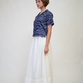The Early Check - in Collection Women Pleated Flare Skirt in White - Umbi