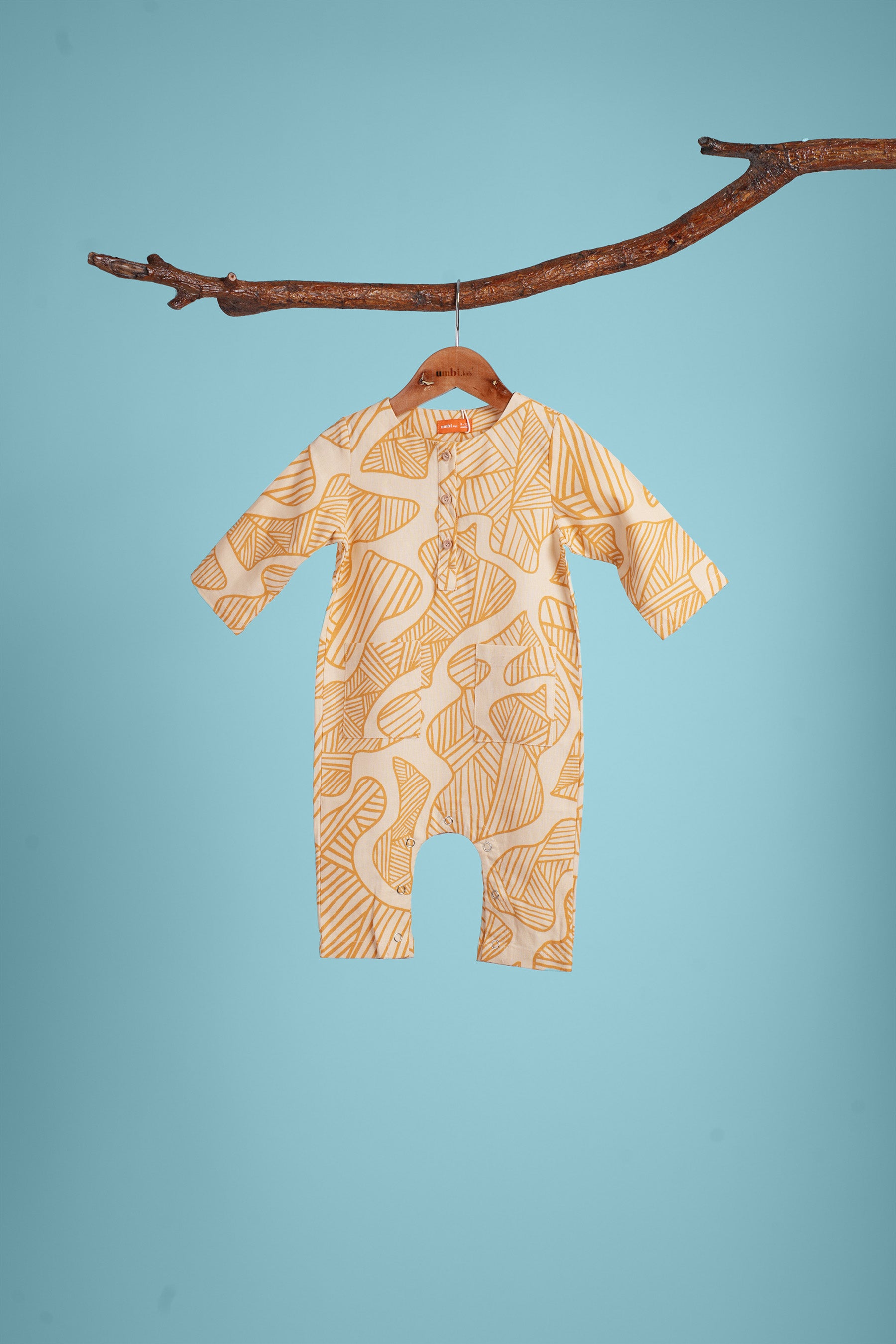 The Kenangan Raya Baby Jumpsuit Gasing Print