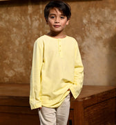 close shot of boy in butter yellow boy long sleeve kurta