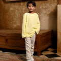 boy standing pose wearing boy butter yellow boy long sleeve kurta