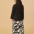 back view of girl in shadow print classic skirt with scallop embroidery