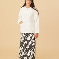 girl donning shadow print classic skirt with scallop embroidery