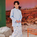 smiling girl posing in mirage print column skirt with back pleats