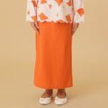 girl in column skirt with back pleats orange