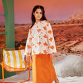 girl posing in orange column skirt with back pleats