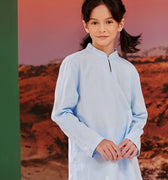 close shot of smiling girl wearing sky blue mandarin collar kurung top