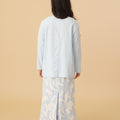 girl posing backwards wearing mandarin collar kurung sky blue