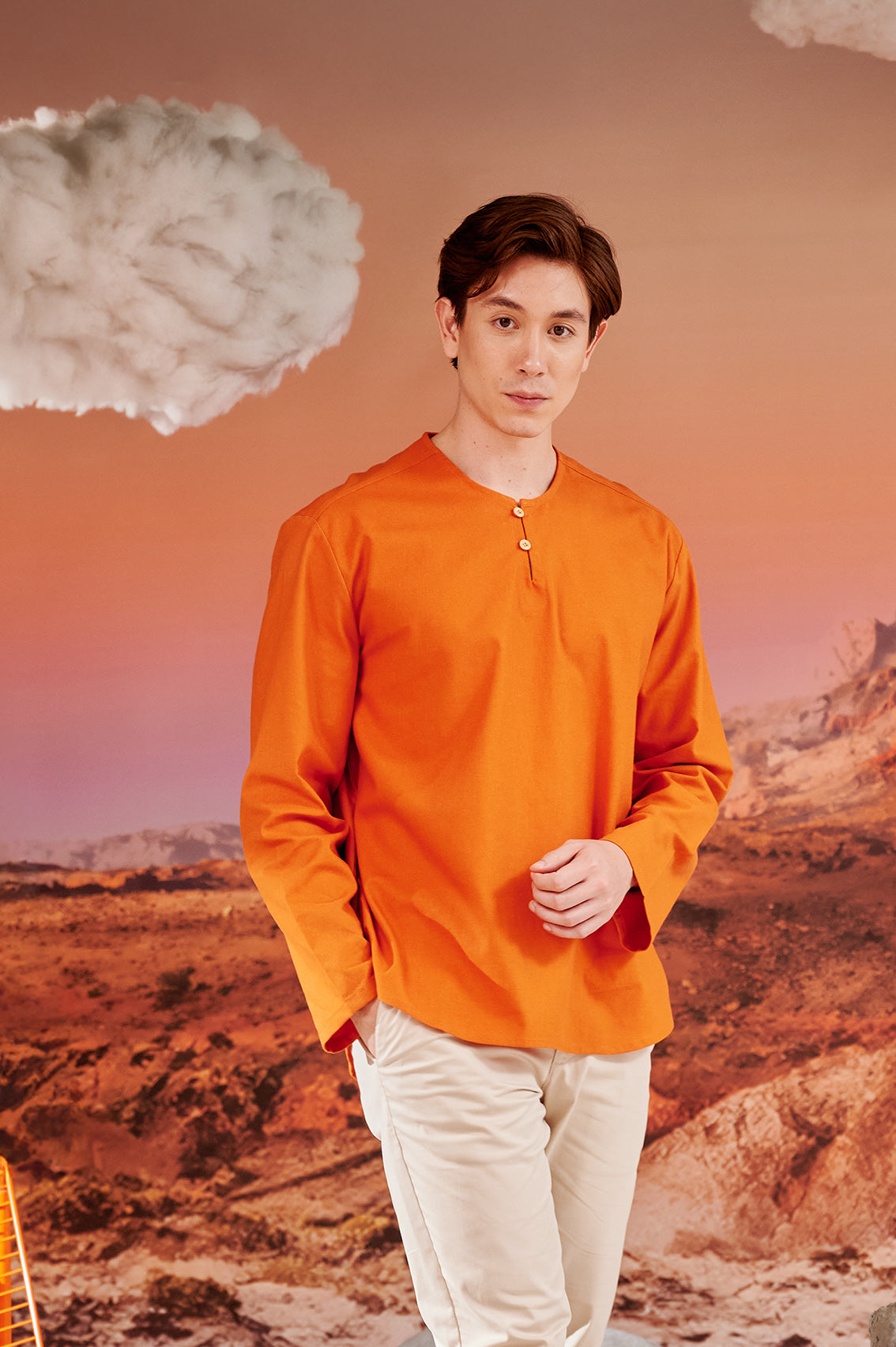 close shot of man wearing orange kurta top