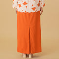 back view of orange column skirt with back pleats