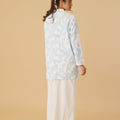 pretty woman standing backwards posing in mandarin collar kurung top mirage print