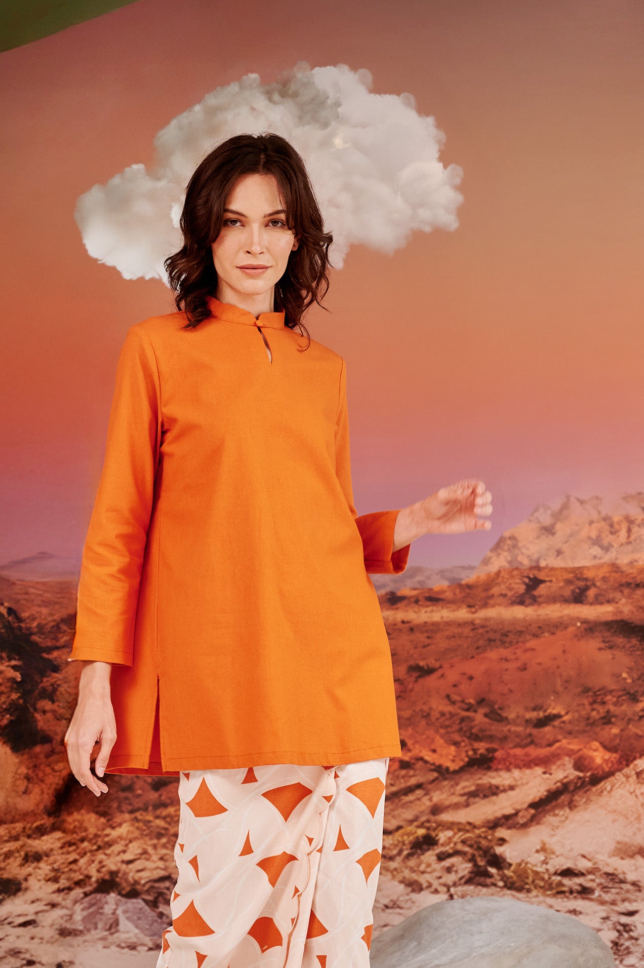 woman close shot wearing orange mandarin collar kurung top