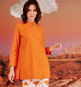 woman close shot wearing orange mandarin collar kurung top