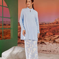 woman looking right posing in mandarin collar kurung top sky blue