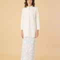 standing pose of woman in mandarin collar kurung top white