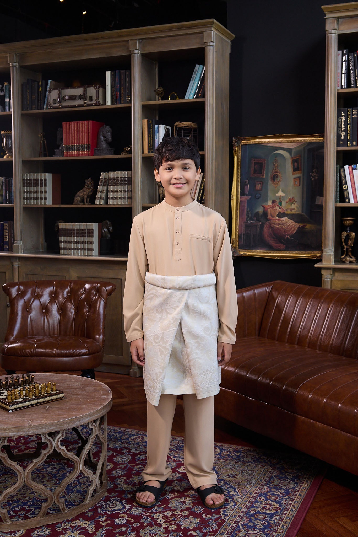 boy standing pose in caramel boy baju melayu set