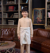 boy standing pose in caramel boy baju melayu set