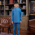 full shot of boy posing in boy baju melayu set steel blue