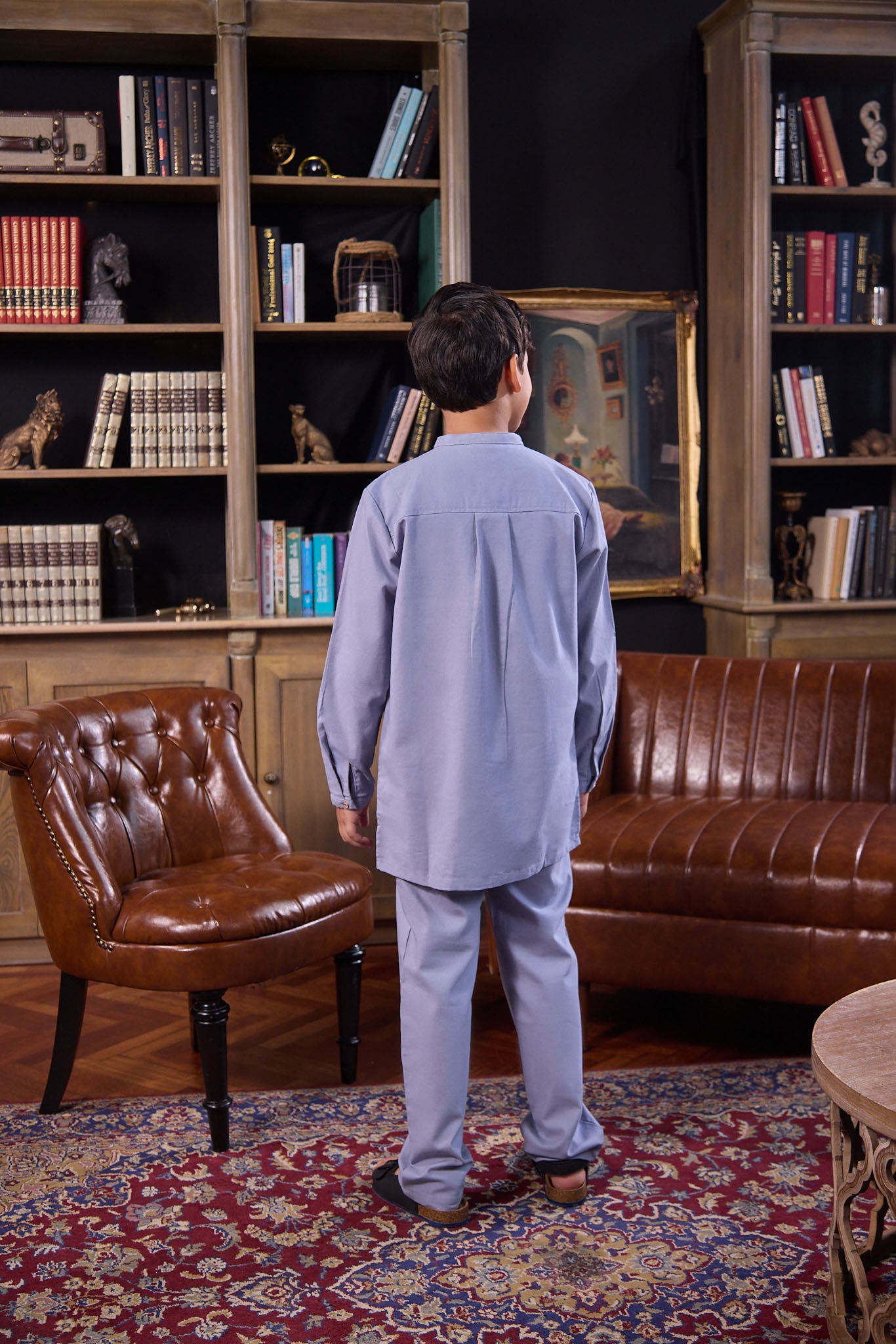 boy posing backwards, donning boy baju melayu set stone blue