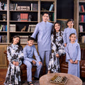 whole family gathers together and posing in the warisan raya collection; stone blue & bunga raya